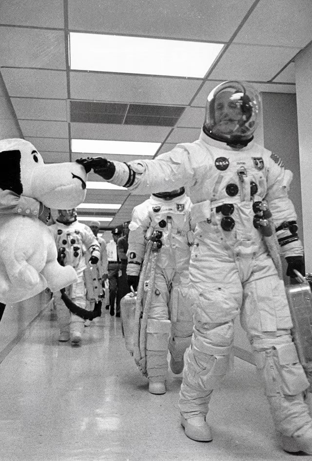 Commander Thomas Stafford touches Snoopy's nose for luck before Apollo 10 mission